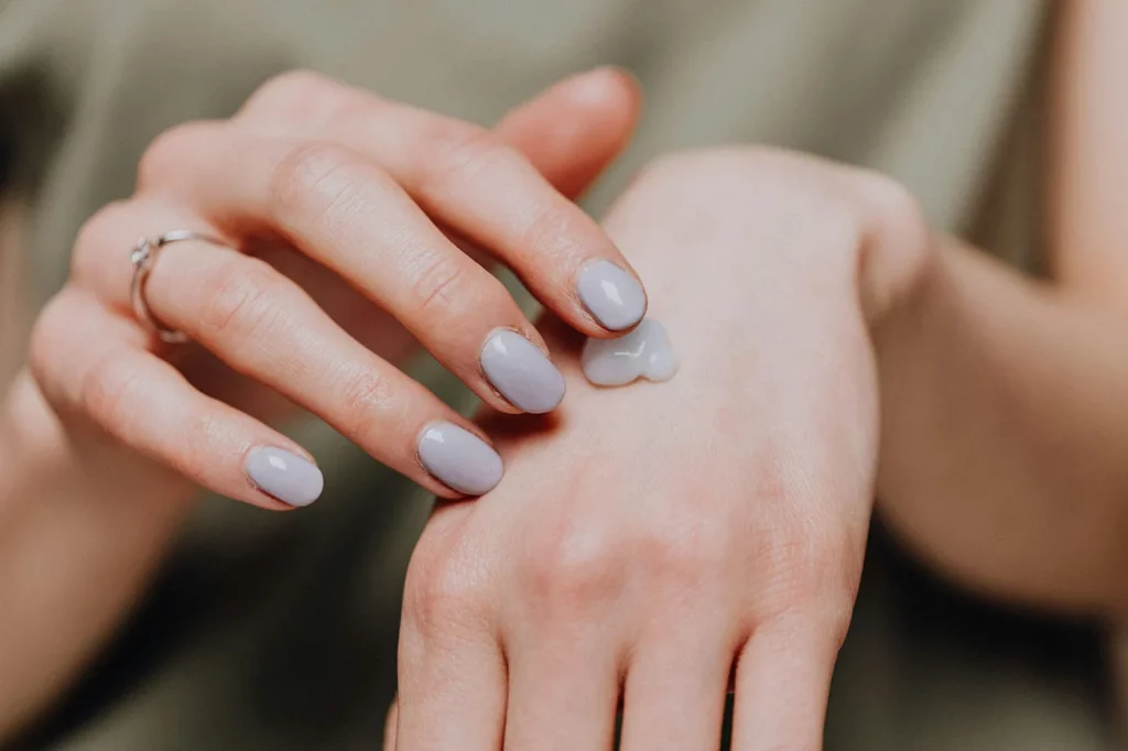 Woman using a non-toxic skincare product