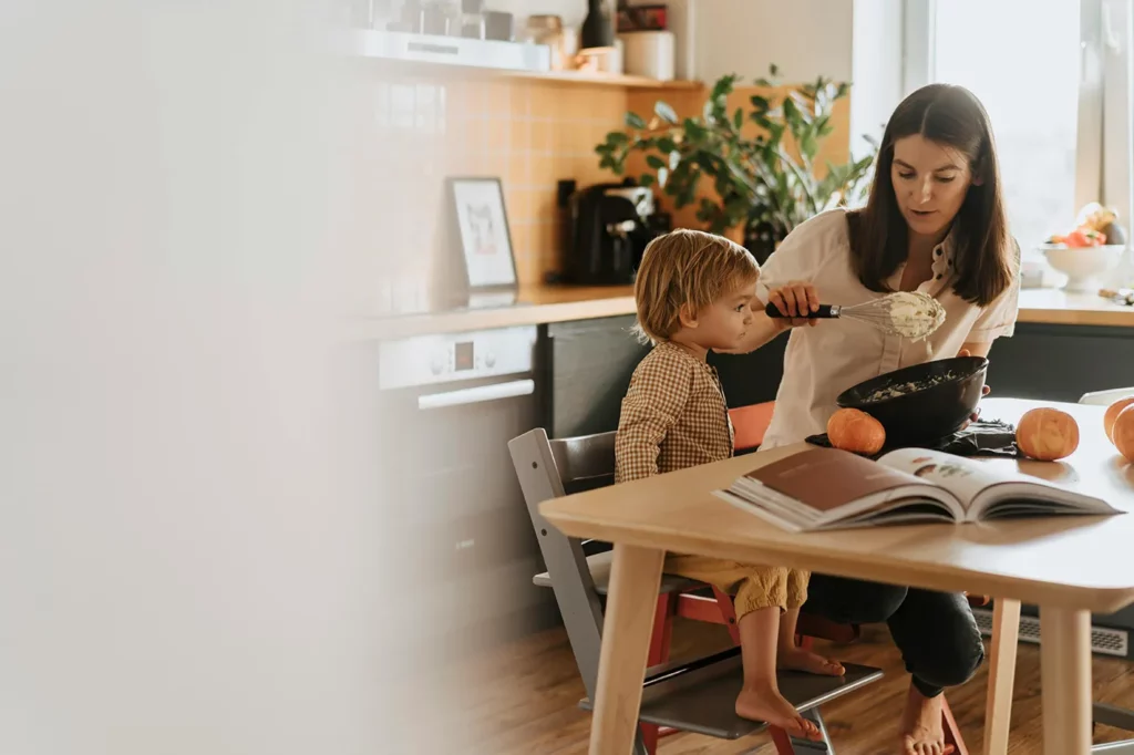 Mom being a good example about healthy cooking and eating with son