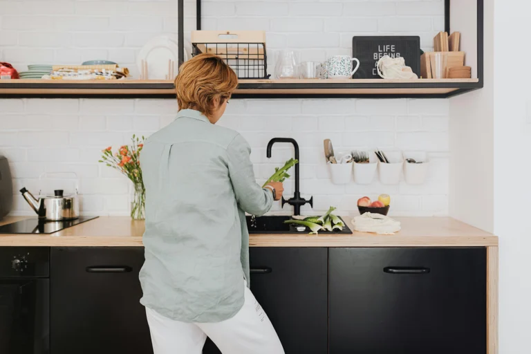 Busy mom and professional cooking a healthy meal for her family